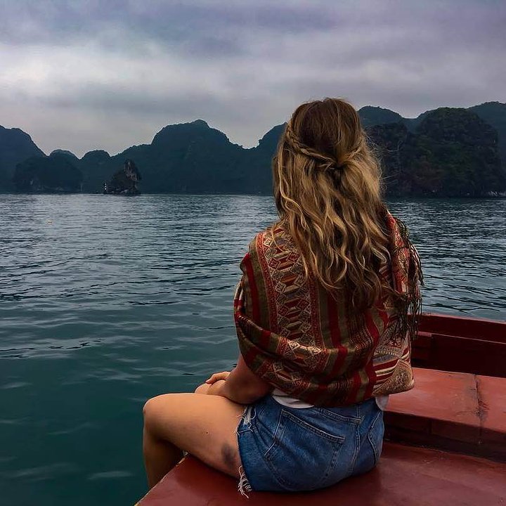Best time to visit Vietnam_solo traveller looking at Halong Bay