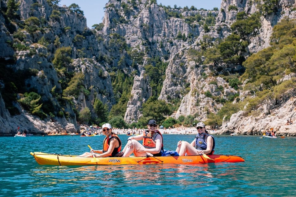 Kayakers paddling into a calanque near Cassis