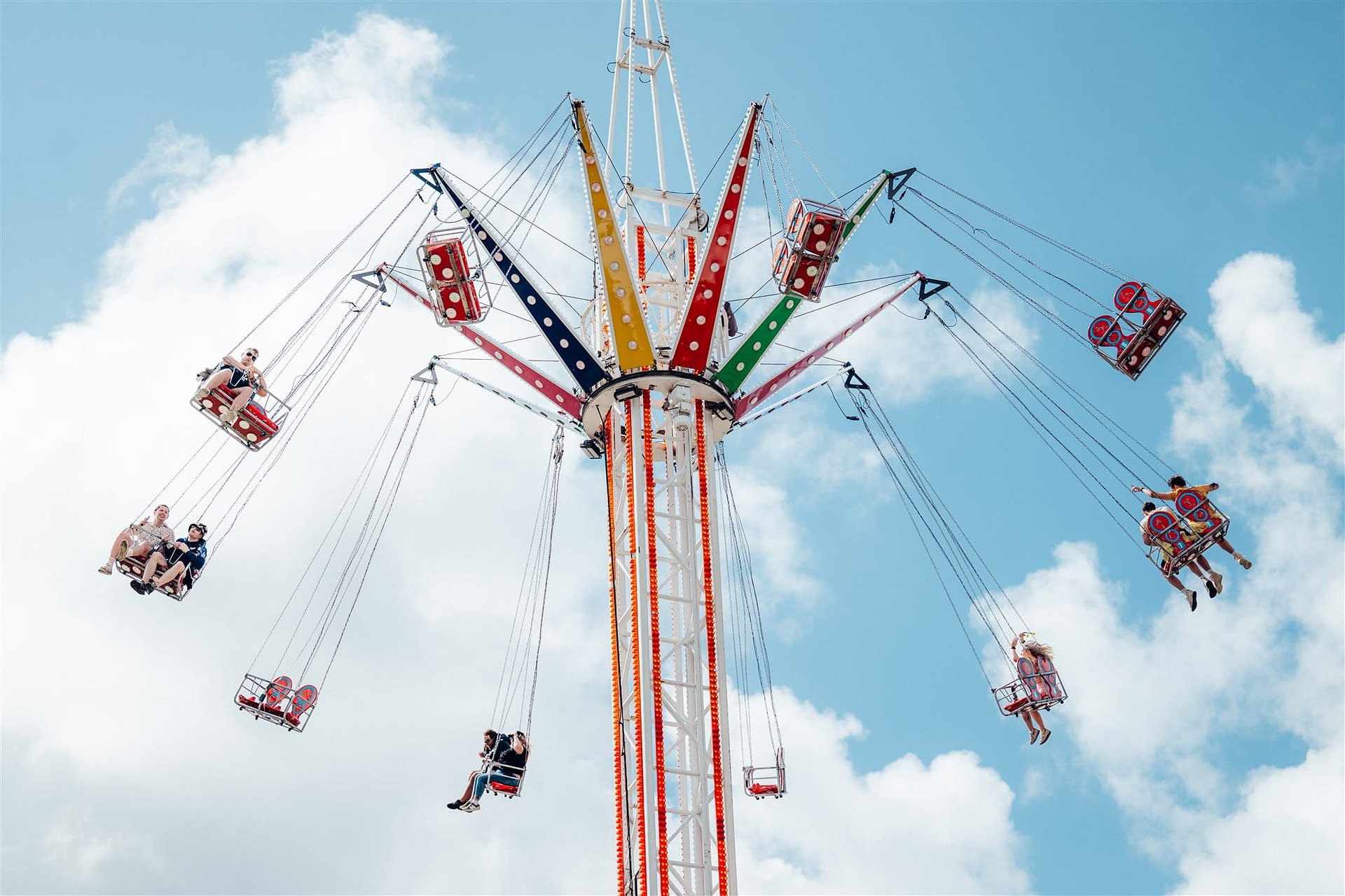 Funfair ride swing in the summer day at Bournemouth 7s Festival in Dorset