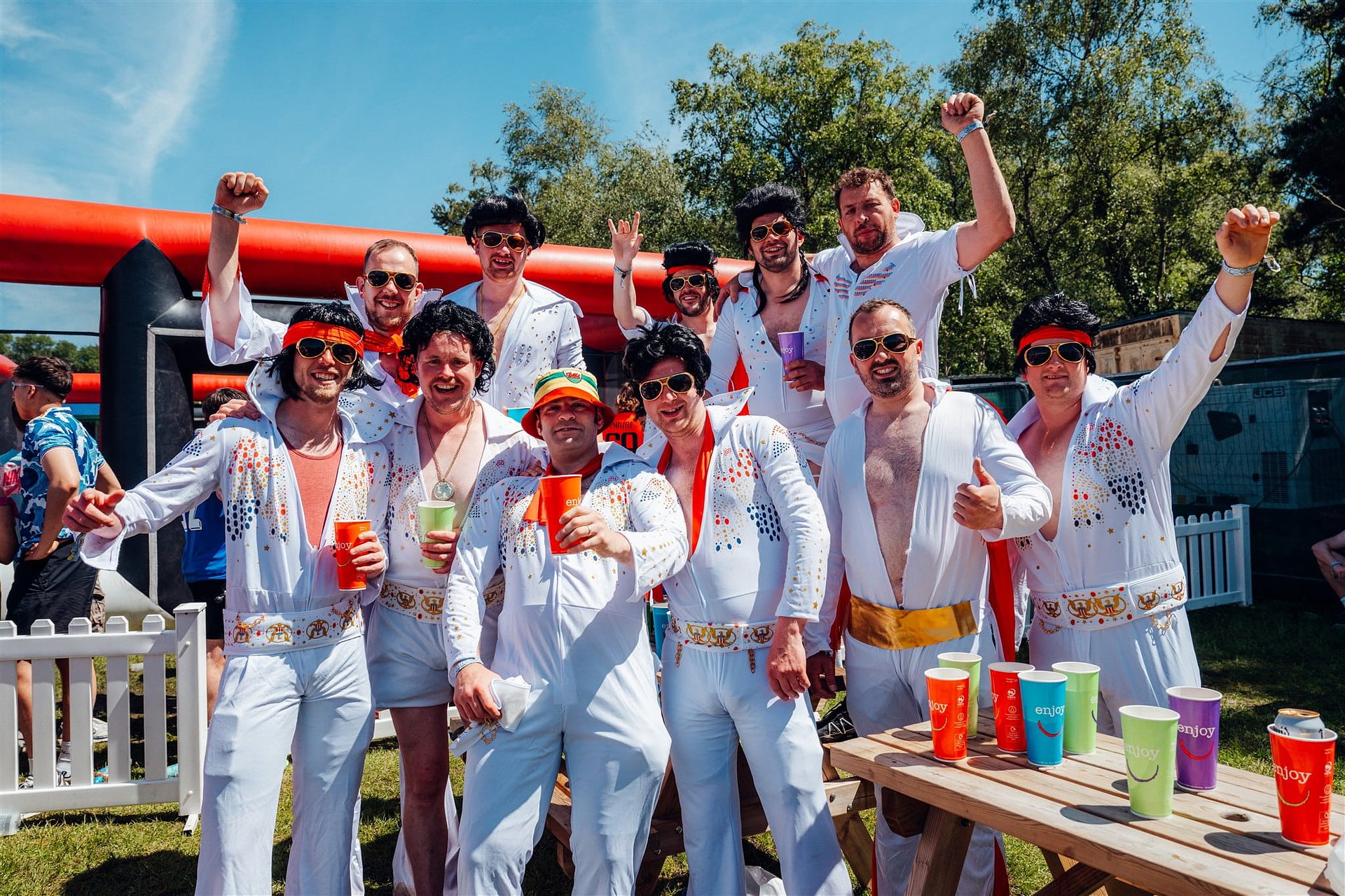 Rugby team dressed as Elvis fancy dress costumes at Bournemouth 7s Festival in Dorset