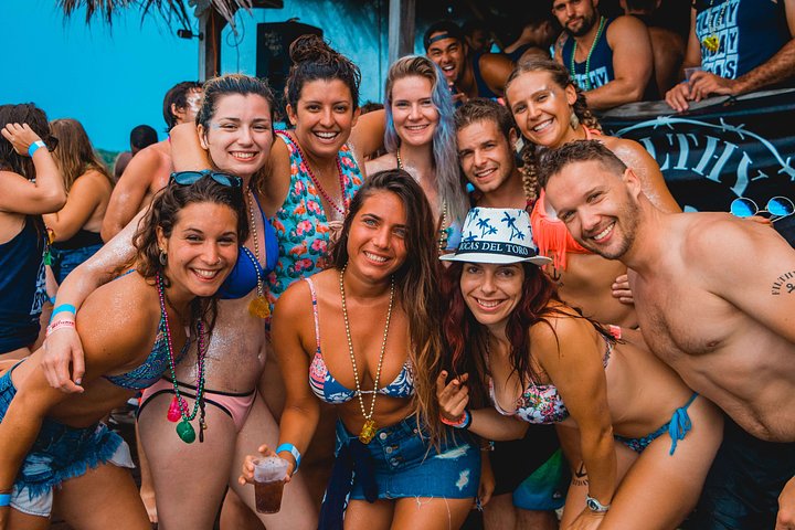 group of people smiling and partying at filthy fridays bocas del toro panama vacations 