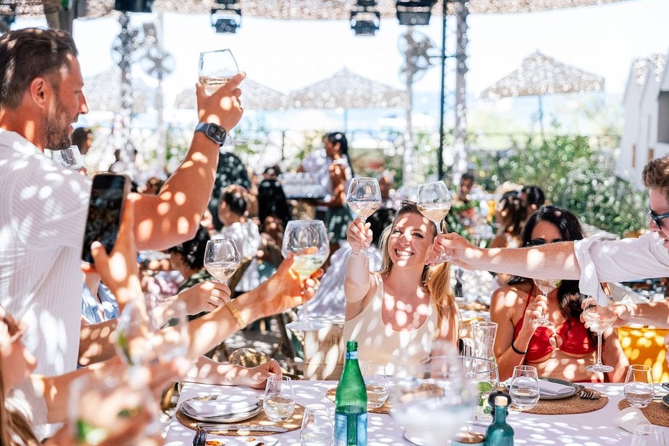 SYB travelers dressed in white at the July 4th party at a beach club in Saint-Tropez