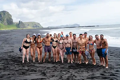 The whole SYB crew together on a black-sand beach