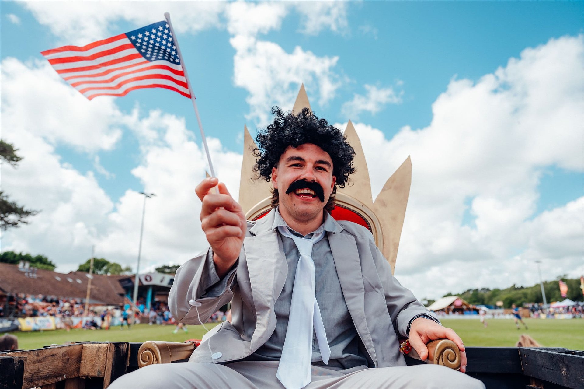 Rugby player dressed as Borat in front of the National Cup Pitch fancy dress costumes at Bournemouth 7s Festival in Dorset