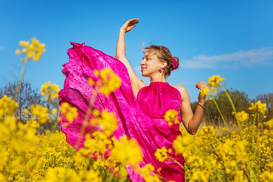 Take a selfie in a field full of mustard flowers in bloom