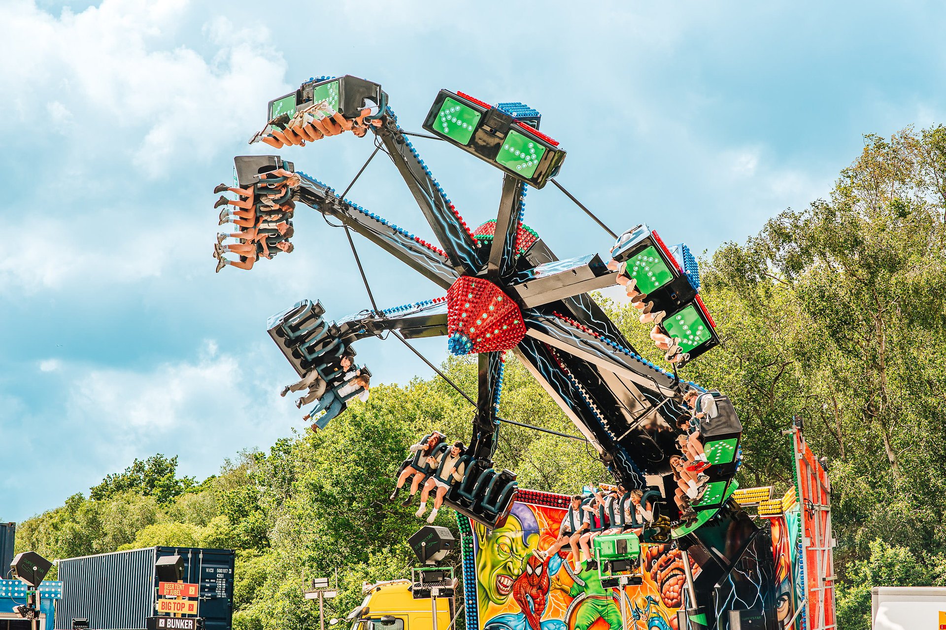 Funfair ride spins around on a summer day at Bournemouth 7s Festival in Dorset