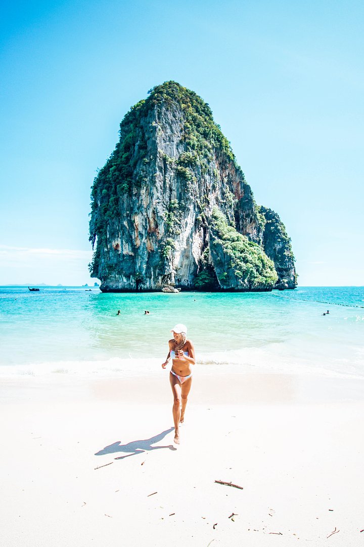 girl running thailand railay beach