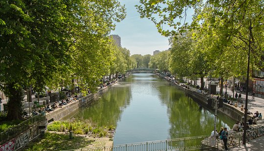 Walk along tree-lined canals