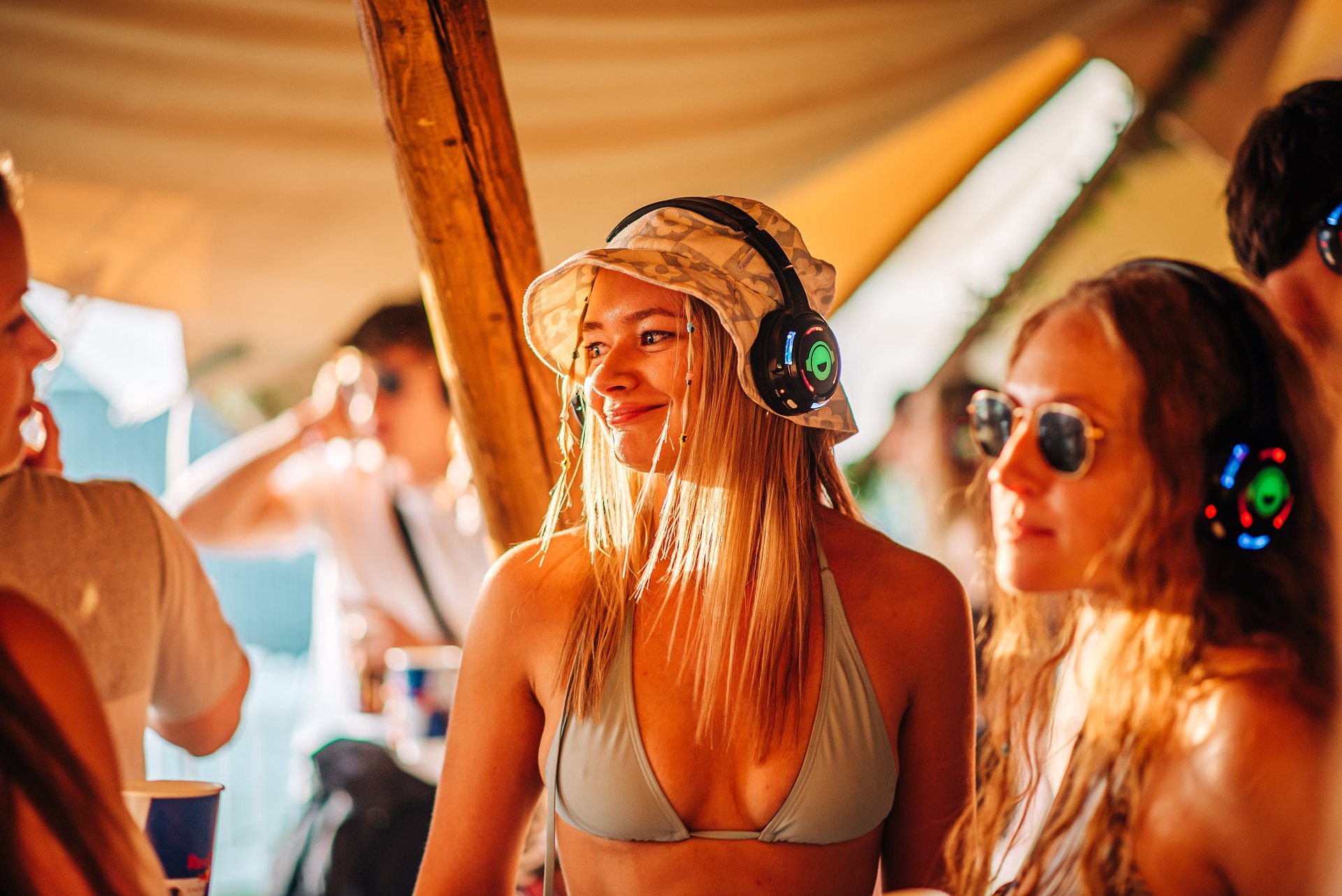 Girl enjoys music in the Silent Disco arena at Bournemouth 7s Festival in Dorset