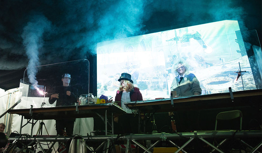 A physics experiment onstage with a Bunsen burner 