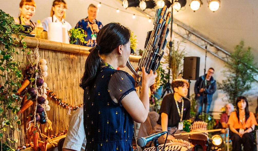 Performers playing at the Taste the World stage 
