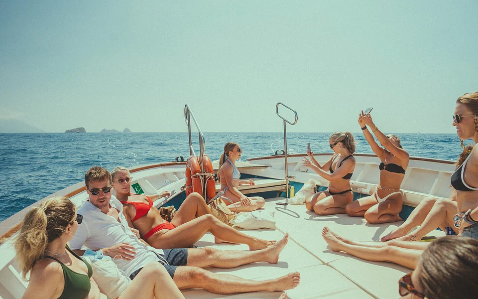 An SYB group lounging on the deck of a boat off the Amalfi Coast