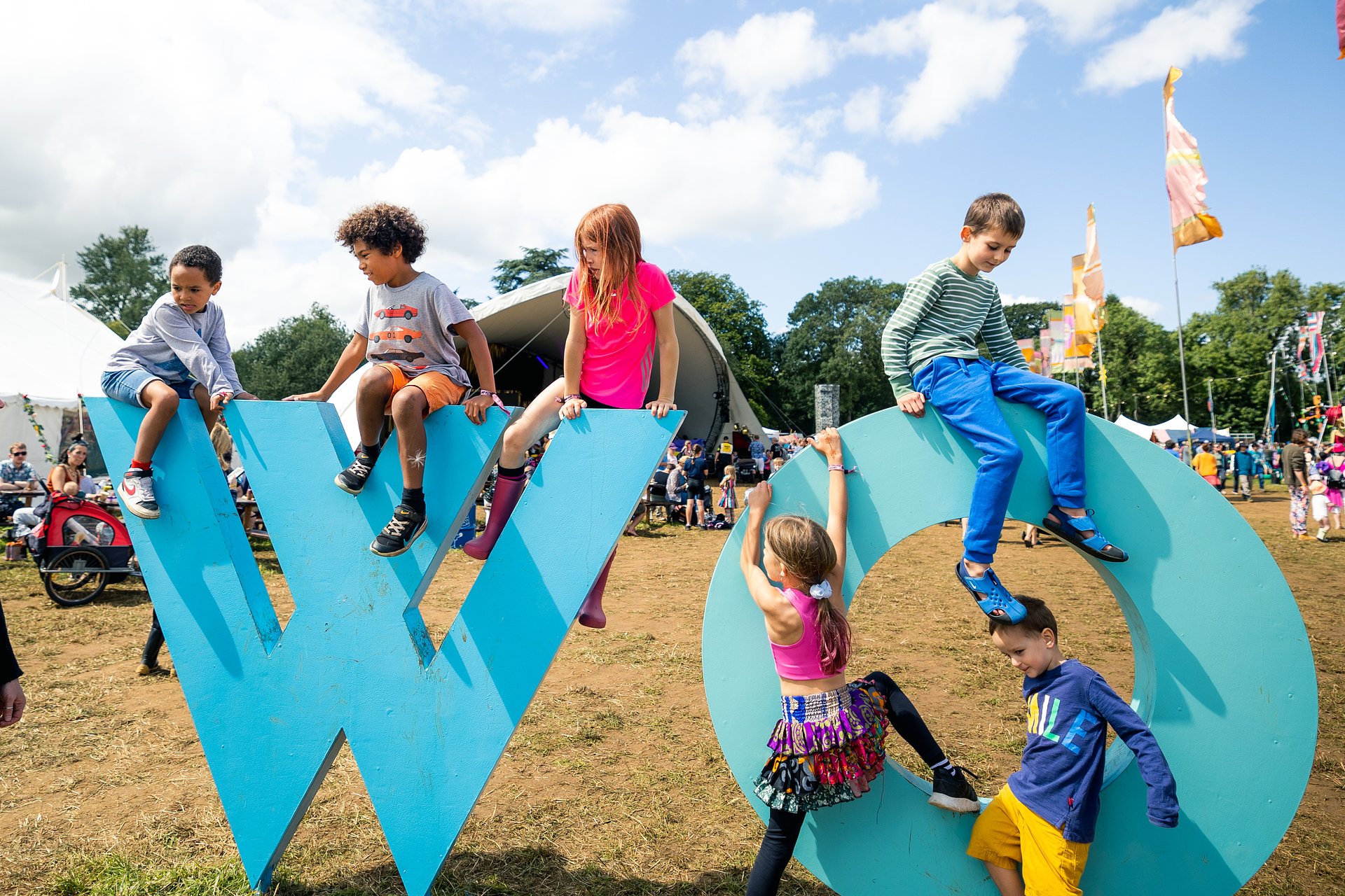 Children climbing on the WOMAD letters