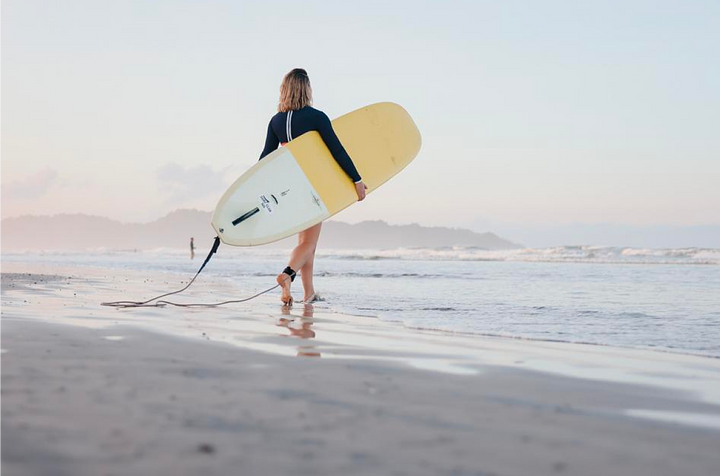 mindfulwavessurftherapywomansurfingnosarasunset
