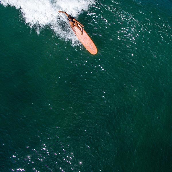 Surfer catching a wave in El Nido Philipines