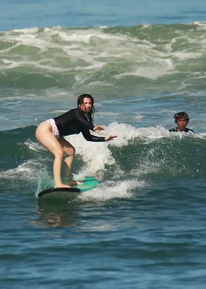 SurfYogaBeer surf lesson on a Bali beach