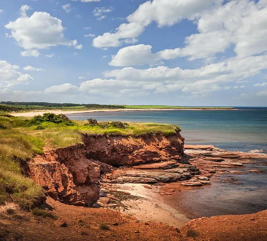 Witness the incredible red sand beaches of Prince Edward Island National Park 