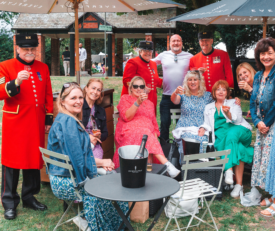 A Chelsea pensioners enjoying  their time with Savour Festival visitors and a glass of wine