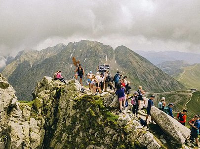SurfYogaBeer group on a summit in the Dolomites