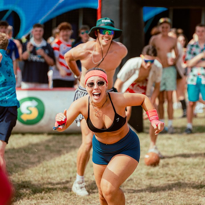 Dodgeball player running towards the camera during a tournament at Bournemouth 7s Festival, in Dorset England.