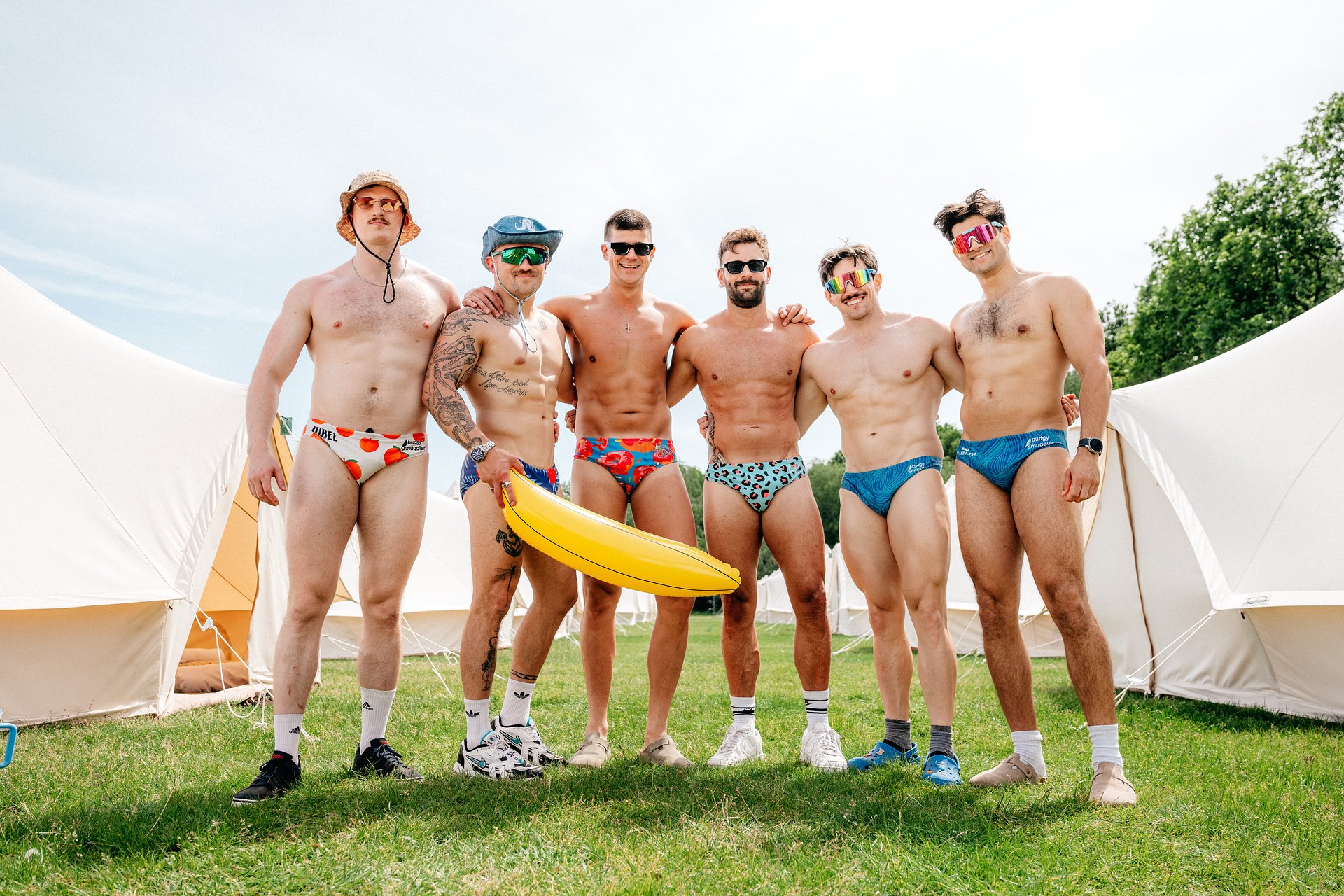 Rugby team in Budgy Smugglers in the glamping area at Bournemouth 7s Festival