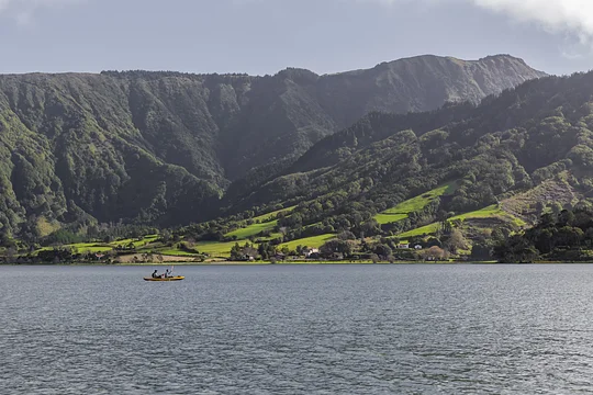 Kayak through two bright blue volcanic crater lakes