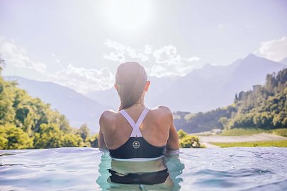 SurfYogaBeer travelers in an alpine lake near Merano, Italy