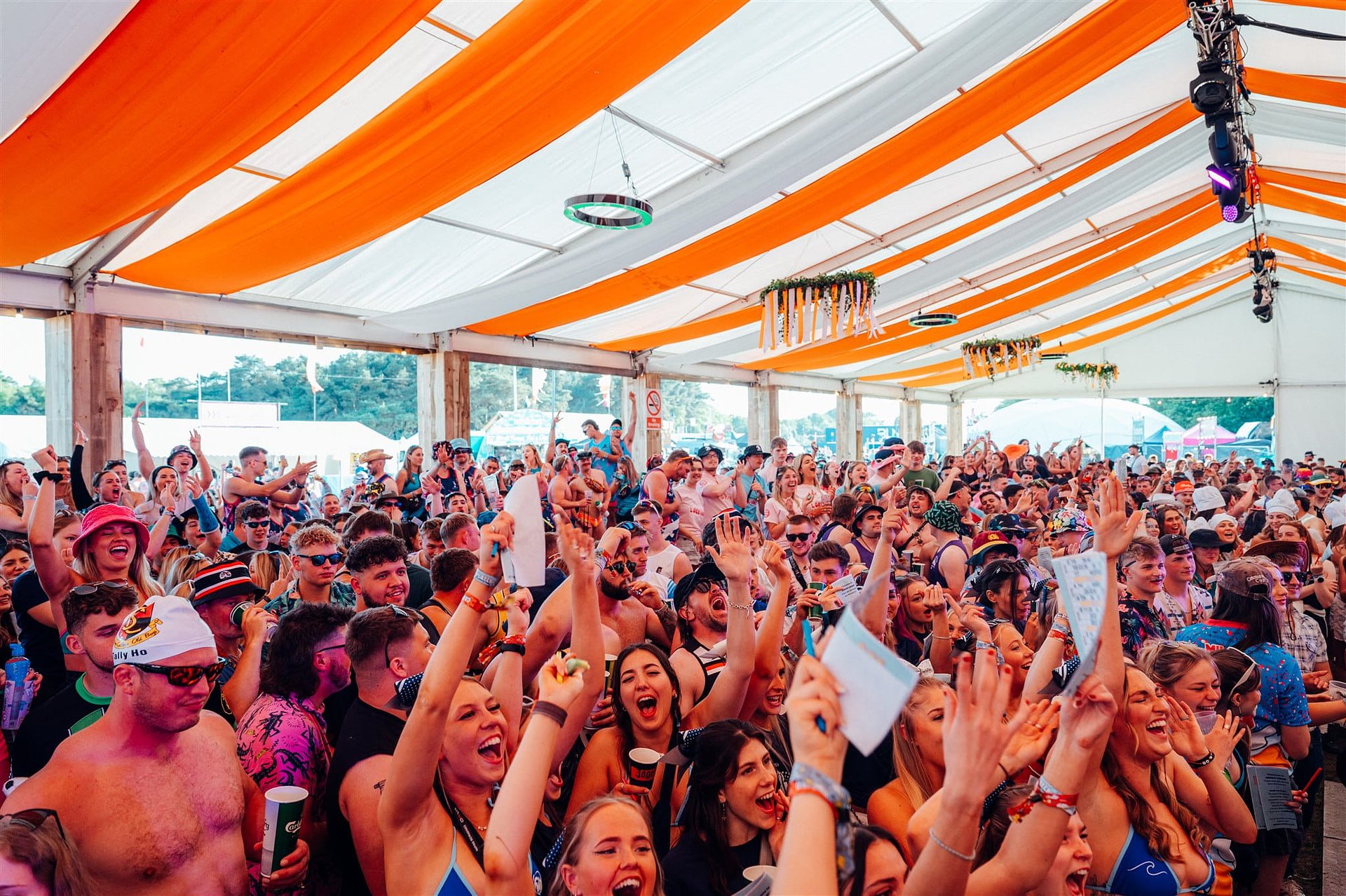 Large crowd cheer during Bingo Lingo at the Friday Opening Party in the Beer Tent by Jubel at Bournemouth 7s Festival in Dorset