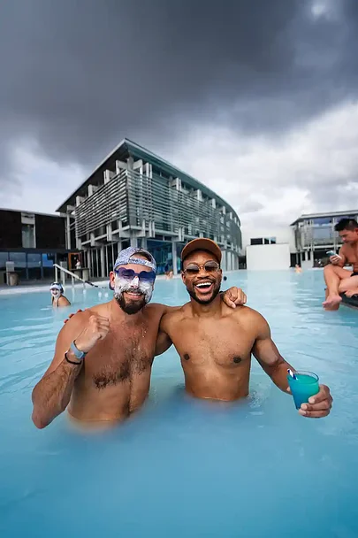 Two guys smiling in a geothermal lagoon