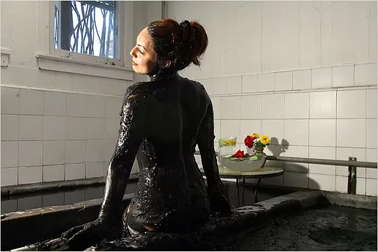 Relax in a mud-bath of volcanic ash in a world-class spa 