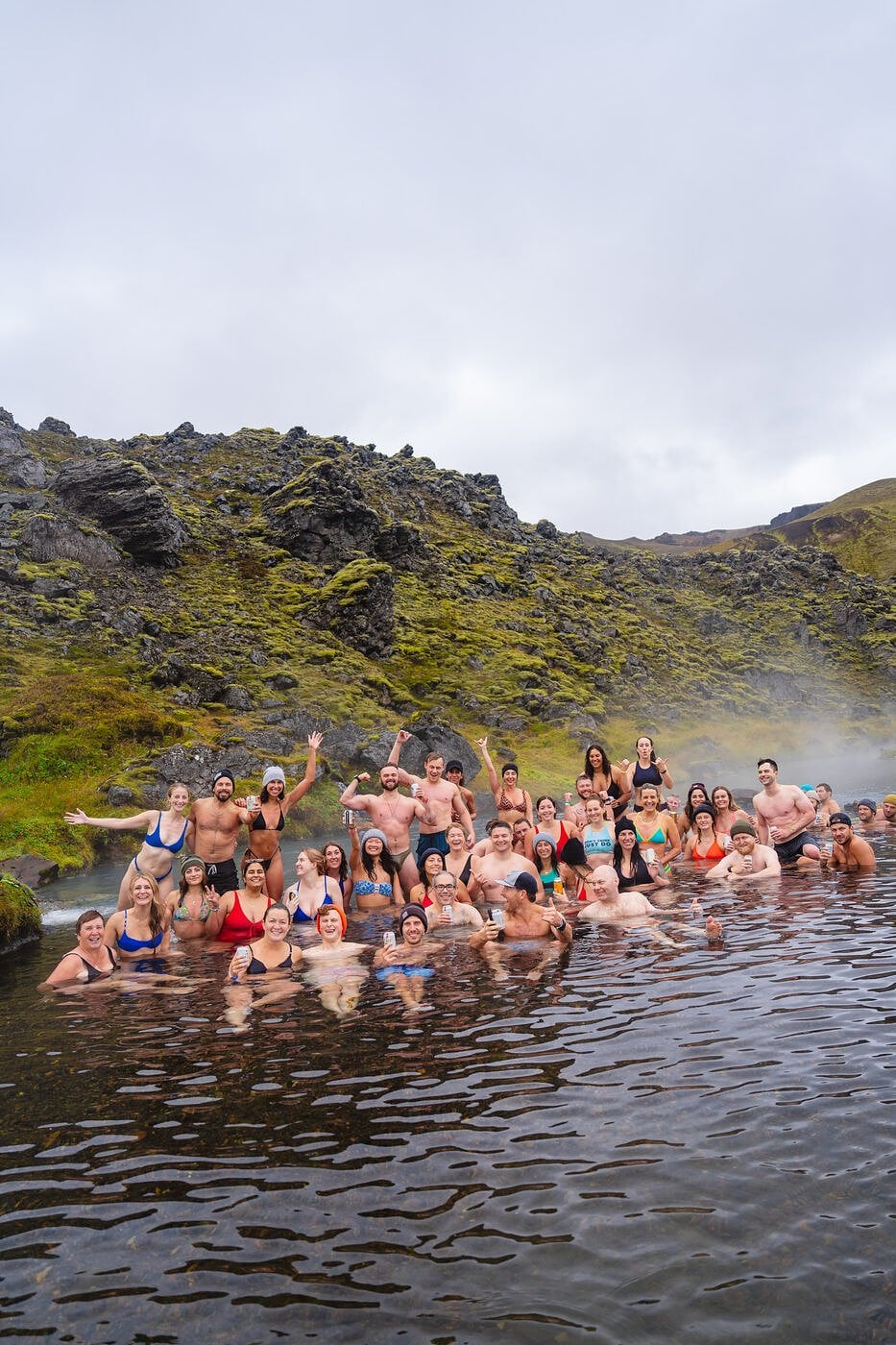 An SYB group soaking in a geothermal river in Iceland