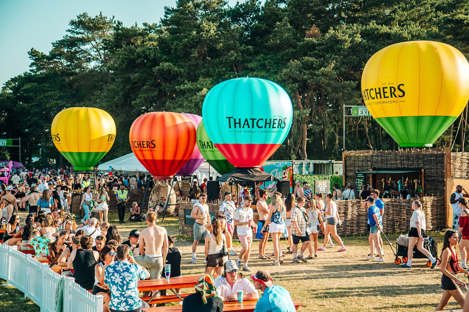 Multi-award winning Thatchers Cider Garden with its iconic balloons, at Bournemouth 7s Festival in Dorset