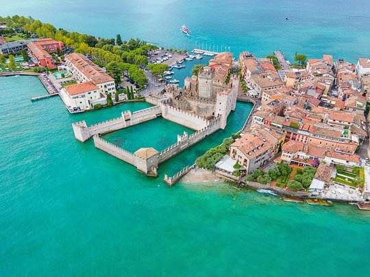 Visit the quaint town of Sirmione with a drawbridge and a castle
