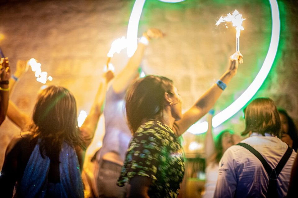SYB travelers holding sparklers at a party night in Croatia