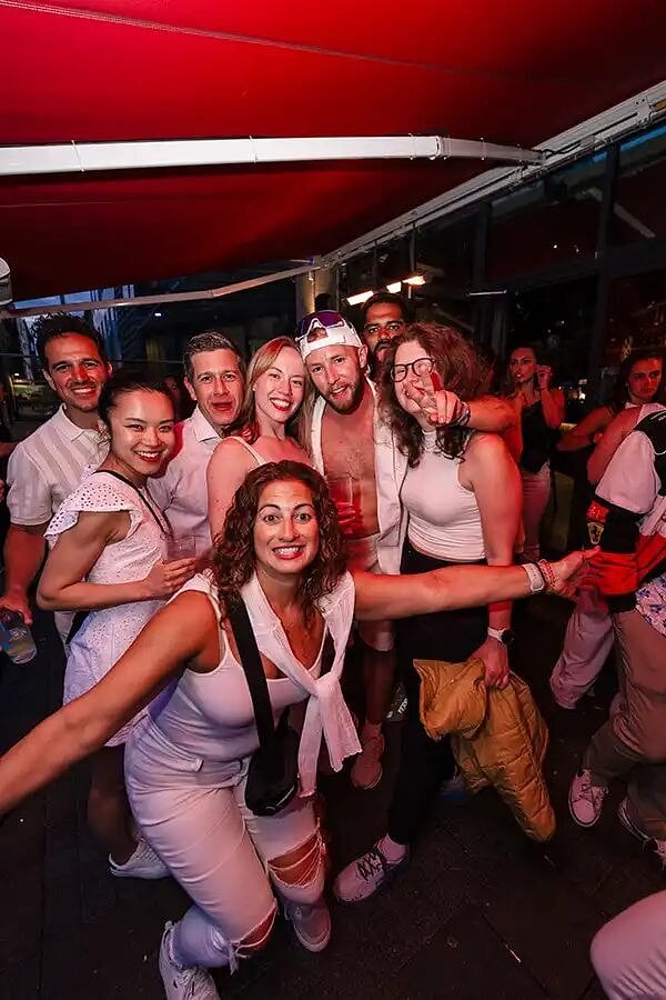 An SYB group dressed in white at a party in Reykjavik