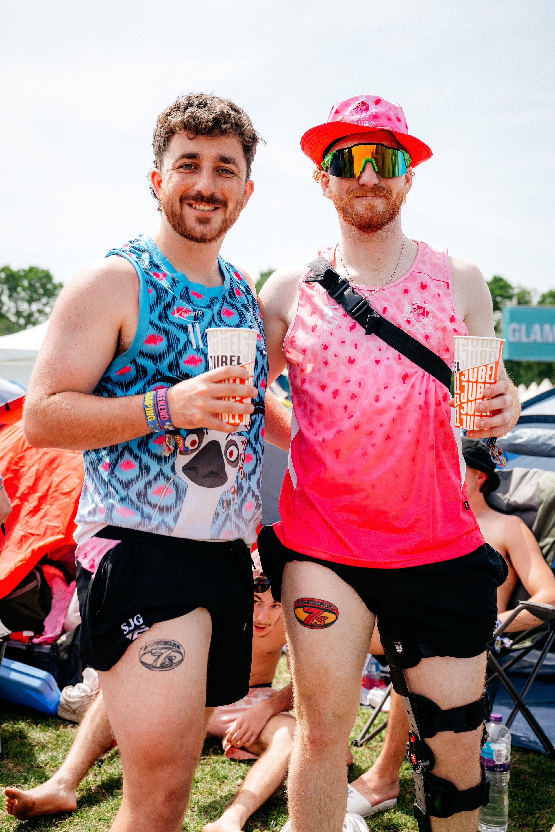 Two rugby boys with Bournemouth 7s tattoos in rugby stash at Bournemouth 7s Festival camping