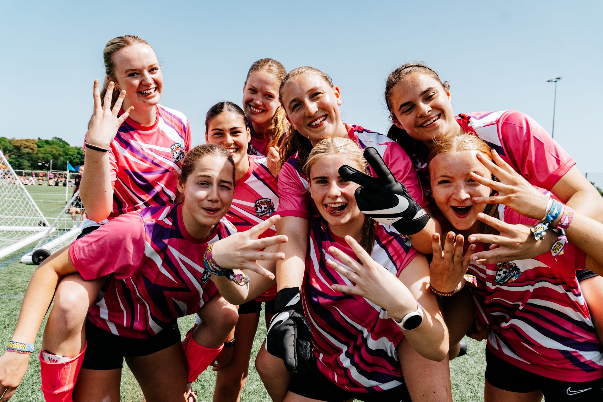 Women's football team celebrate after a 6-a-side competition tournament at Bournemouth 7s Festival, in Dorset.