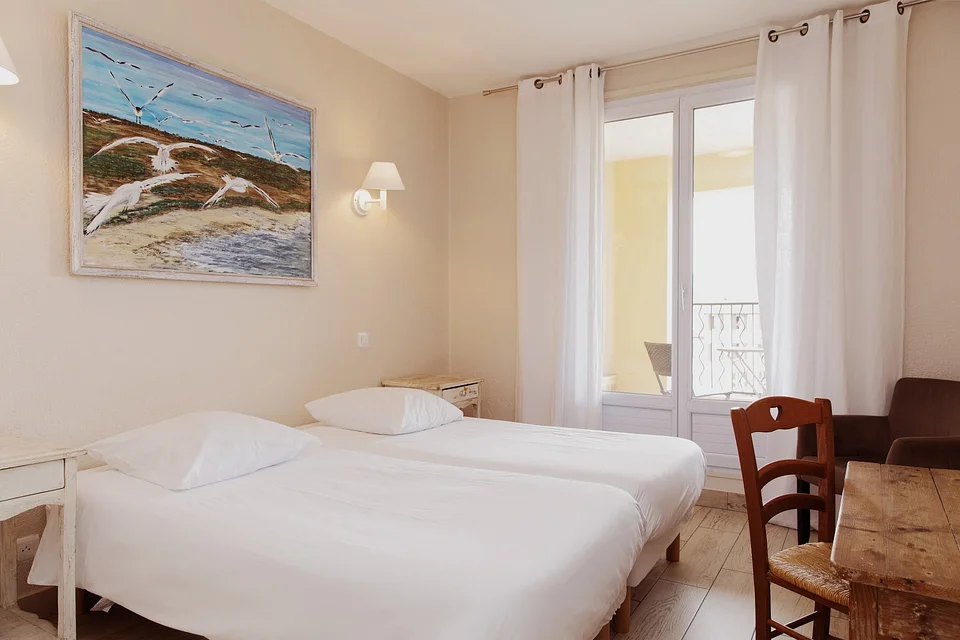 A twin room at a hotel in the South of France