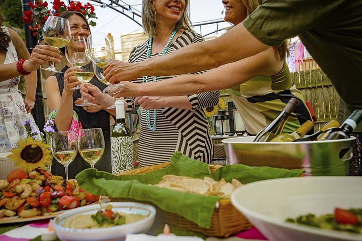 groupofpeopleatgardenpartyholdingwineglas20250404075936utc
