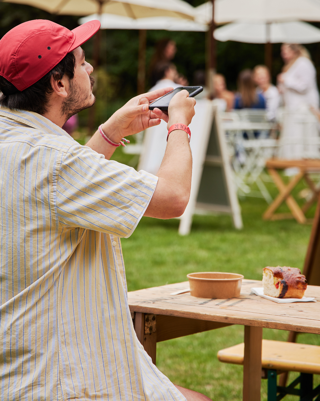 Savour Festival visitor takes pictures of his amazing dishes from Frenchie Covent Garden at Savour Festival best London’s food festival, Global Flavors on Display: International Food Stalls at Savour Festival