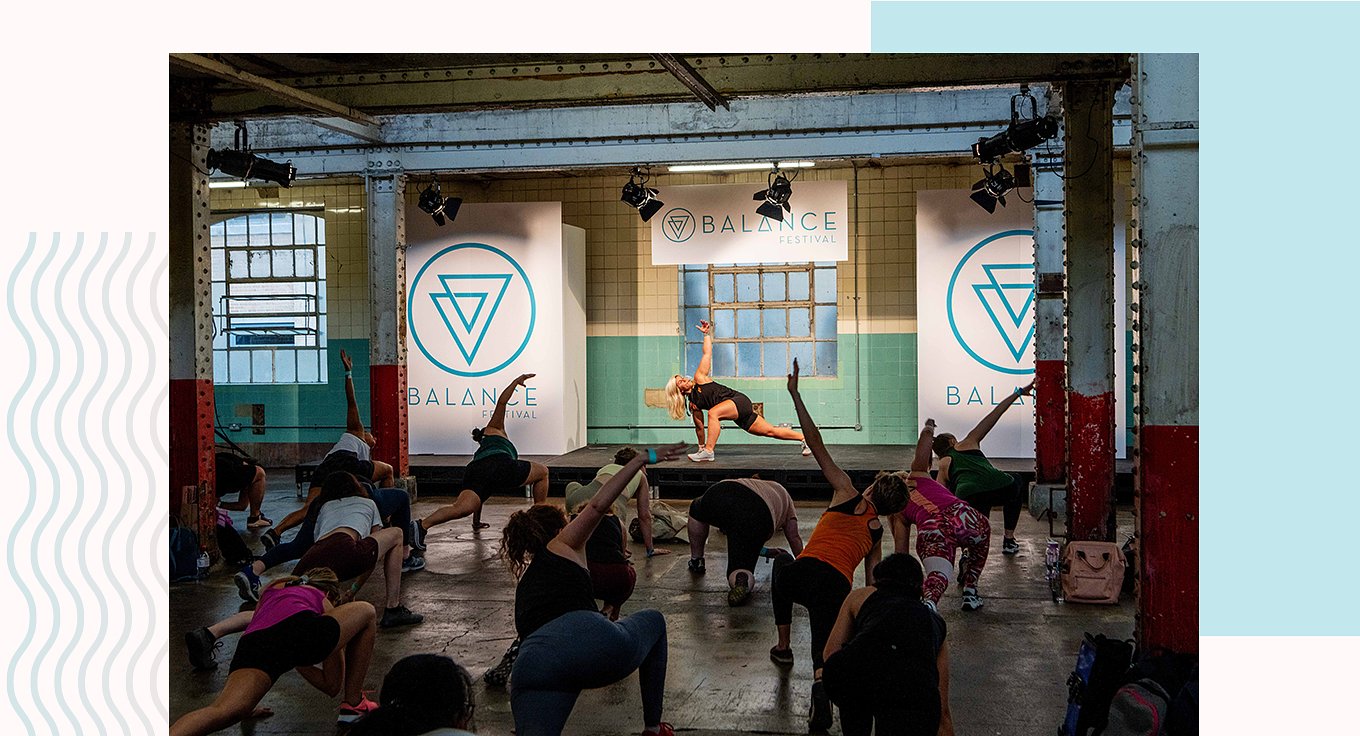 group of people stretching at balance festival